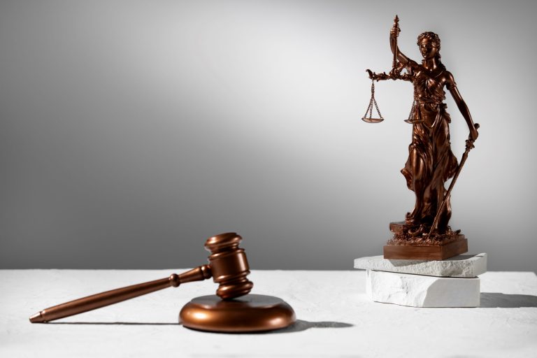 gavel-justice-FP Gavel and Lady Justice statuette illustrate blog "5 Things You Need To Do If You Are Facing Criminal Charges"