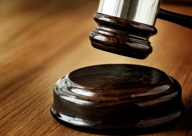 law-rawpixel-FP Closeup of gavel about to hit sound block illustrates blog "Understanding Criminal Law: What You Need to Know"
