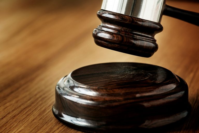 law-rawpixel-FP Closeup of gavel about to hit sound block illustrates blog "Understanding Criminal Law: What You Need to Know"