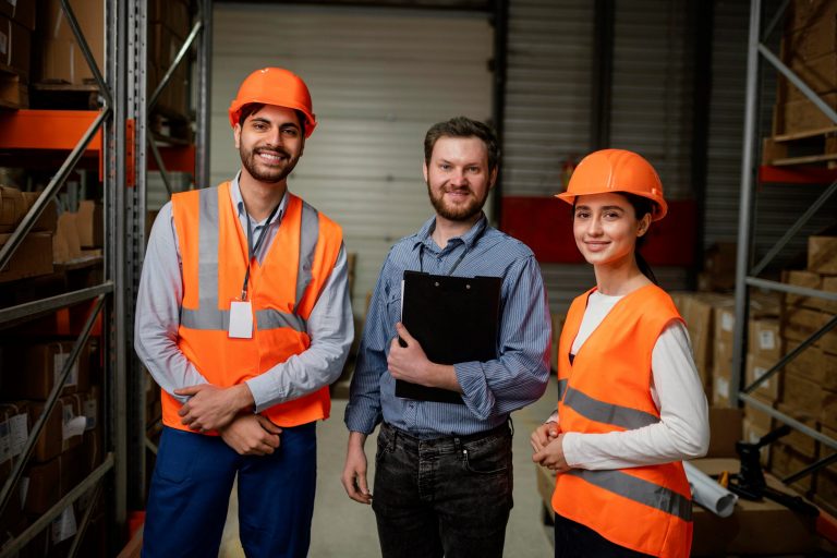 workers-comp-FP Workers wearing hardhats and safety vests illustrate blog "Understanding the Basics of Workers' Compensation"