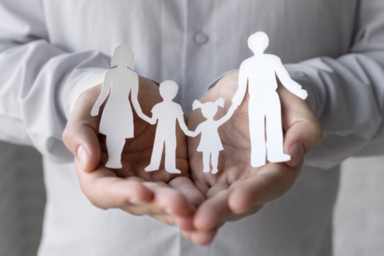 family-law-fp Man holding paper cutout of family illustrates blog "Making Sense of Family Law: a Glossary"
