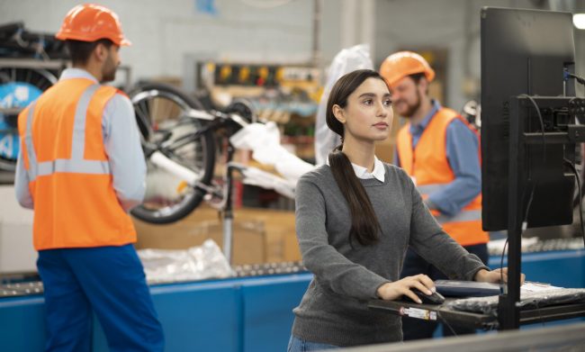 workers-comp-fp2 A woman and two men at work illustrate blog "When To Hire a Workers' Comp Lawyer?"