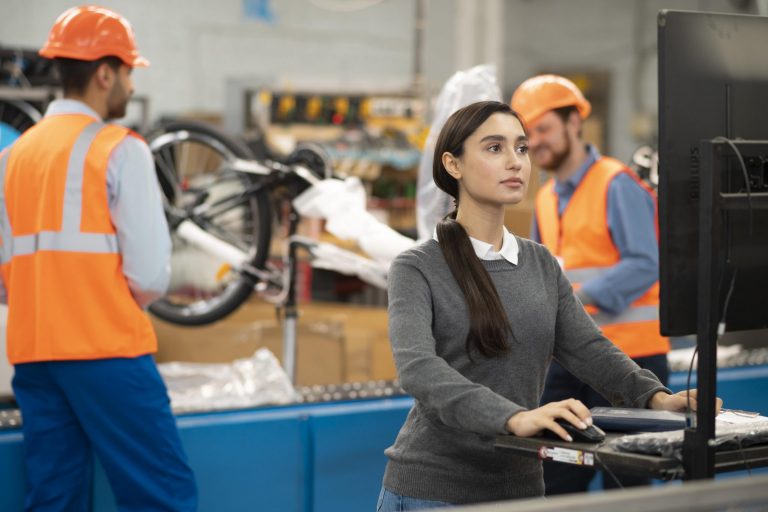 workers-comp-fp2 A woman and two men at work illustrate blog "When To Hire a Workers' Comp Lawyer?"