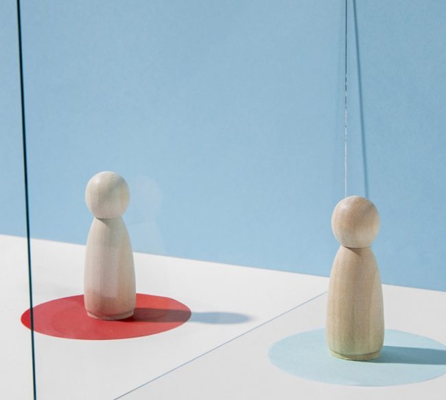 custody-freepik Two wooden figurines in red and blue circles respectively, illustrate blog "Child Custody: Understanding Your Rights and Options"