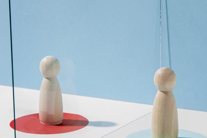 custody-freepik Two wooden figurines in red and blue circles respectively, illustrate blog "Child Custody: Understanding Your Rights and Options"