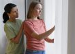 Woman comforting friend illustrates blog "Family Law: What Is a Restraining Order?"