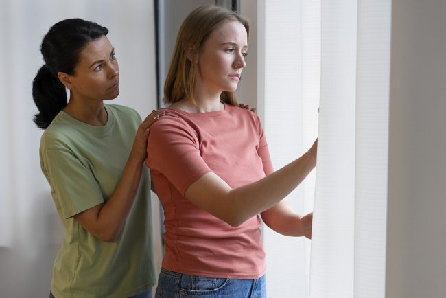 female-support-freepik Woman comforting friend illustrates blog "Family Law: What Is a Restraining Order?"