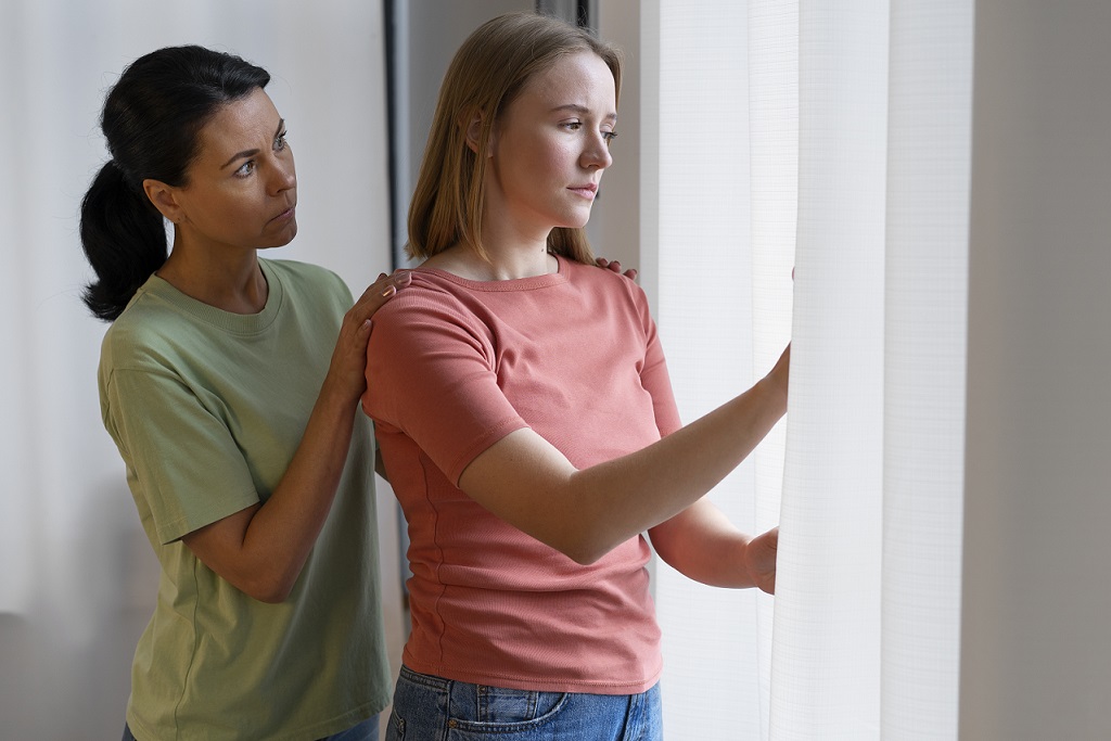 female-support-freepik Woman comforting friend illustrates blog "Family Law: What Is a Restraining Order?"