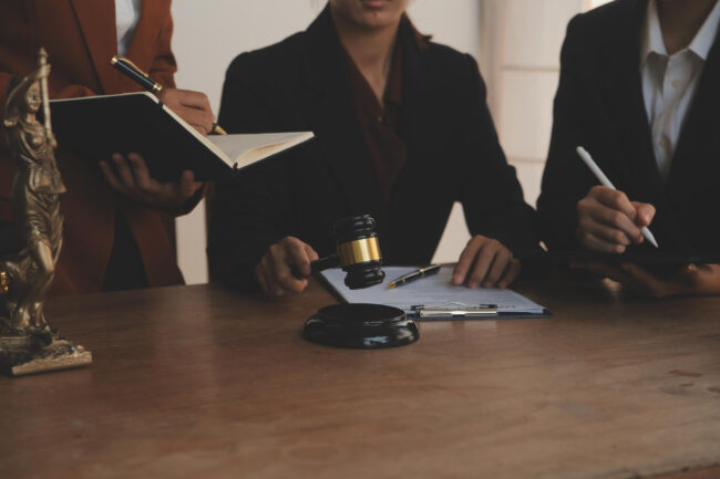 attorney explaining criminal case process to client in office