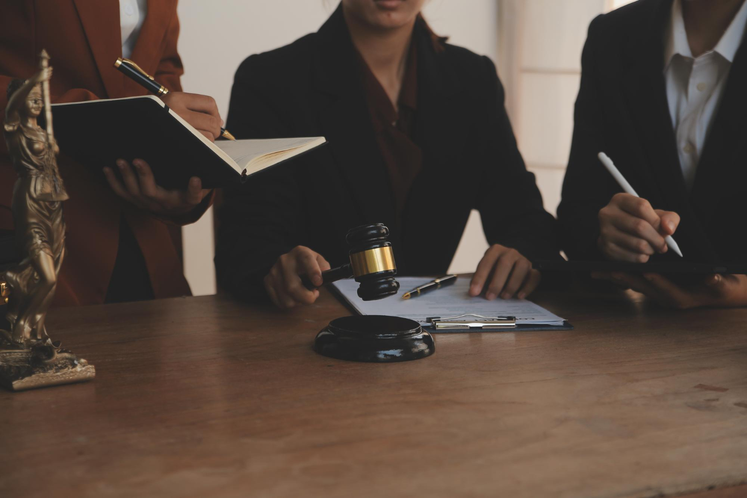 attorney explaining criminal case process to client in office