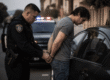 Professionals reviewing someone is arrested california strategy and planning documents