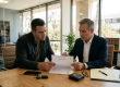 Criminal defense attorney discussing property after arrest in California with a client during a legal consultation.